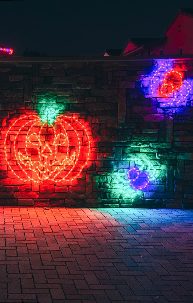 Close view of professionally installed holiday lights and décor at a guest-facing entrance