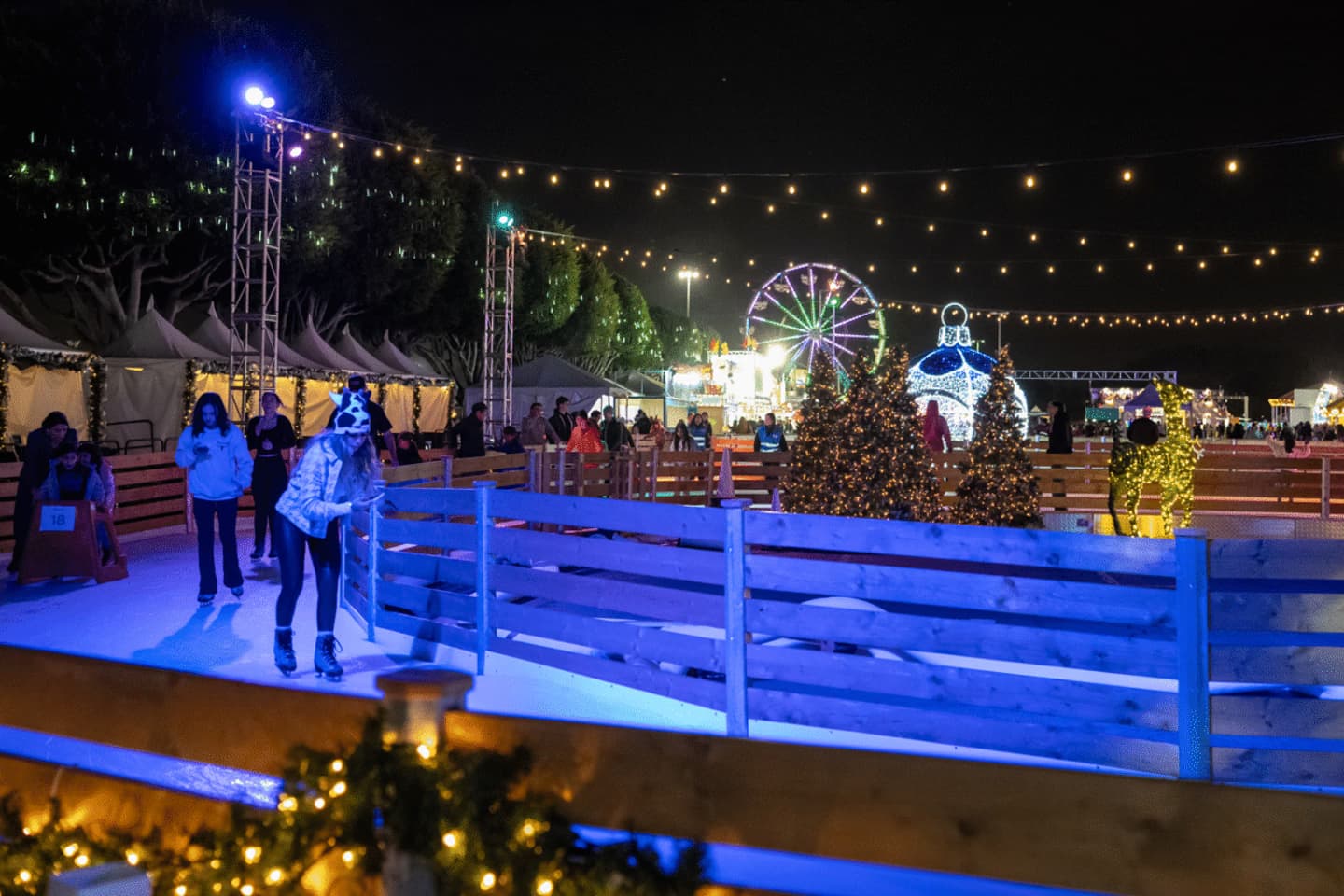 Winter Fest OC ice trail surrounded by Christmas trees, ornaments and holiday lights