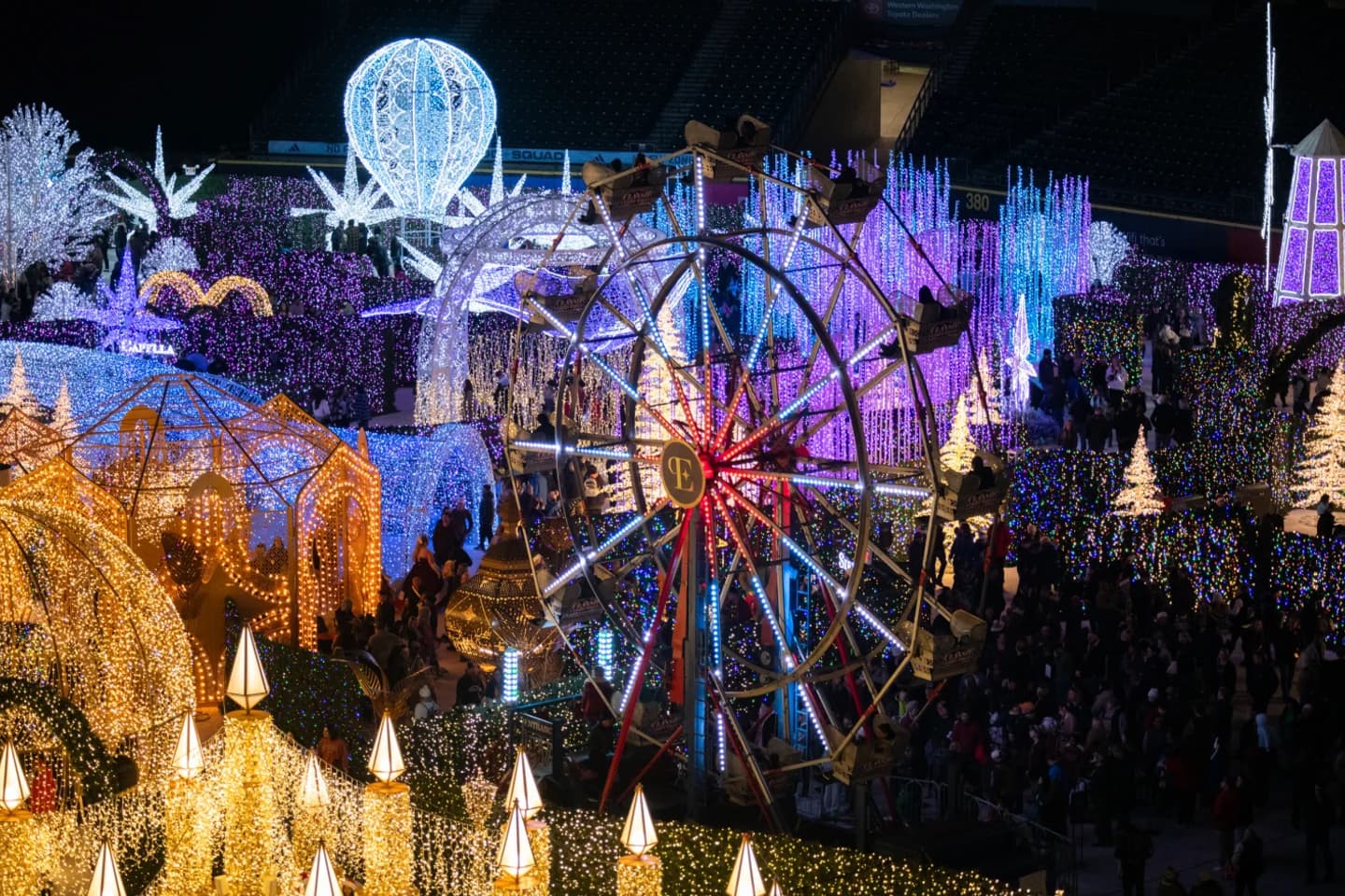 Enchant Christmas light maze and illuminated Ferris wheel at Santa Anita Park