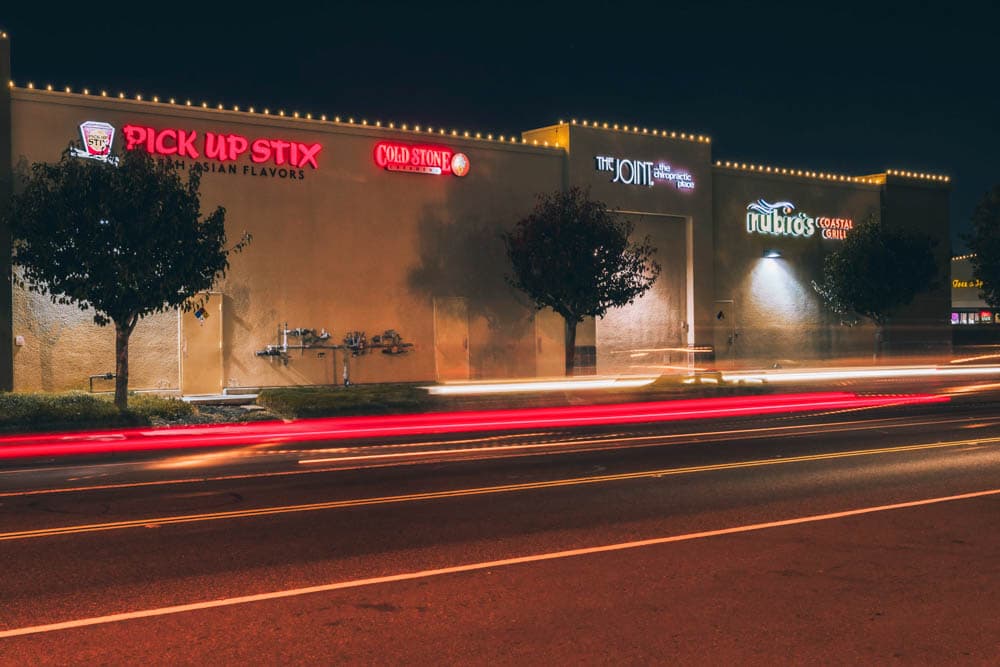 Lakewood Galleria storefront rooflines illuminated in warm white by Holiday Light Installations
